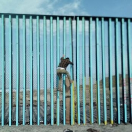 Man escaping over fence