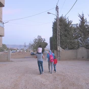 Lebanese research assistants on a tour of the neighbourhood in the Bekaa Valley, Lebanon, led by two Syrian children who have been displaced.