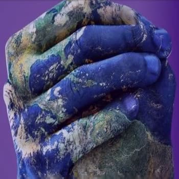 two earth patterned hands clasping each other