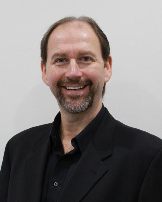 headshot of chris brennan