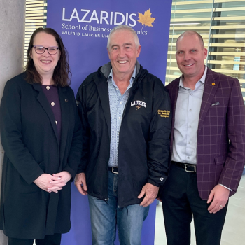 Dan Einwechter with Deborah MacLatchy, Laurier president and vice-chancellor, left, and Jason Coolman, Laurier vice-president of Advancement and External Relations