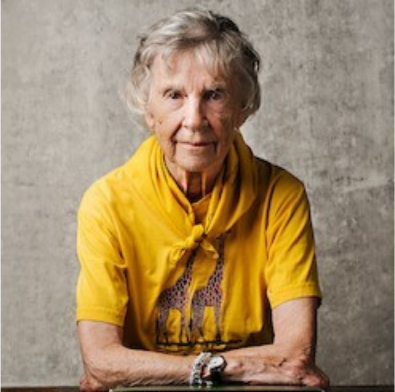 Anne Dagg at a table