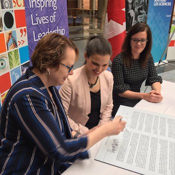 Laurier president signs Dimension charter 