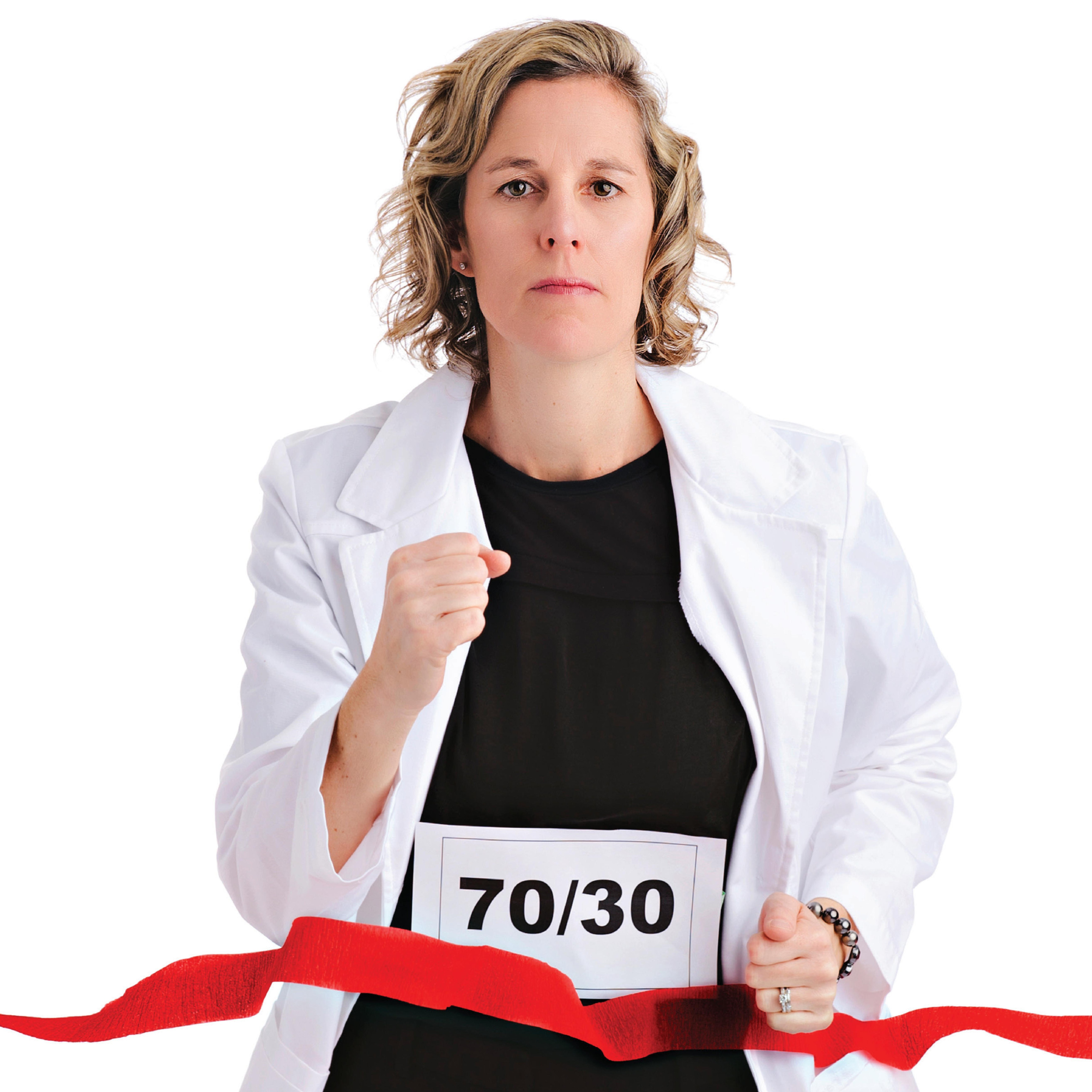 a woman crosses a finish line