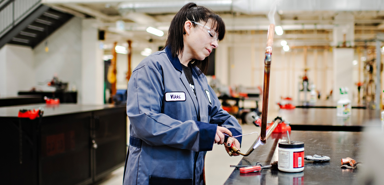 a woman welds