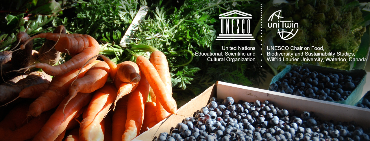bundle of carrots with overlay of UNESCOx (United Nations Educational, Scientific and Cultural Organization) and uniTwin (UNESCO Chair on Food, Biodiversity and Sustainability Studies, Wilfrid Laurier University, Waterloo, Canada) logos