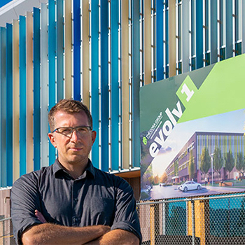Spotlight story image pertaining to Manuel Riemer in front of evolv1 building